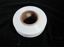 Spool of white Lycra Fiber